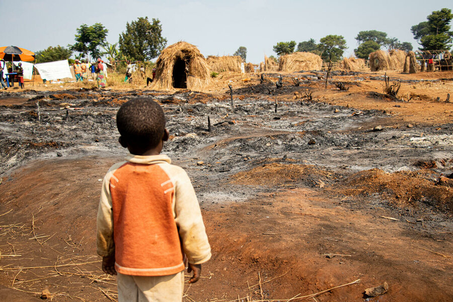 A boy gazes at the fire-wrought damage of a camp for conflict-displaced people in South Kivu province, DRC, where WFP provides food assistance. &nbsp;Photo: WFP/Michael Castofas