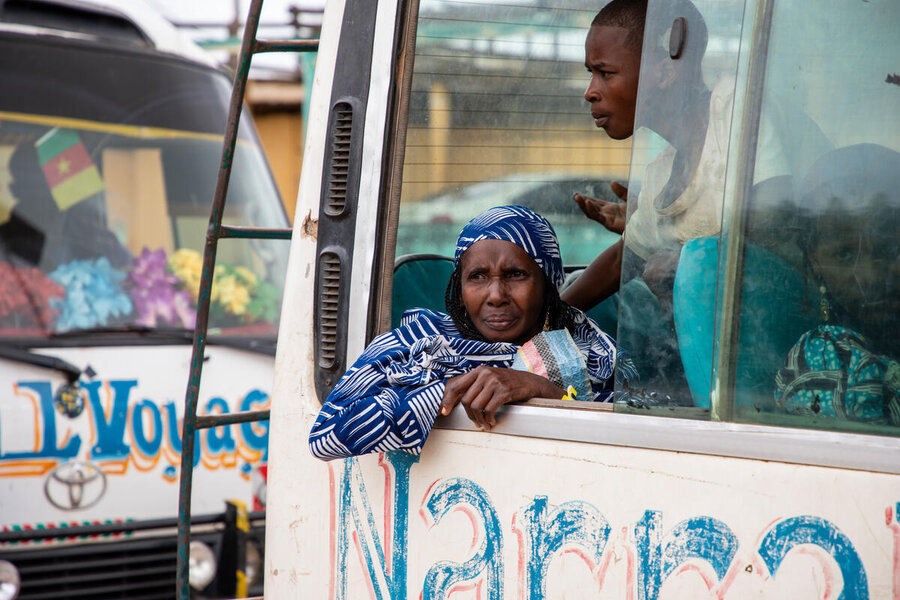 A woman stares out the window of a bus. Photo: WFP/Aurore Vinot