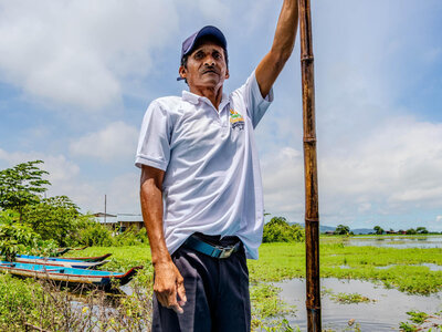 Resident of Los Espinos, Ecuador standing on a canoe for transporting people as the community has been impacted by heavy rains. WFP/Gonzalo Ruiz