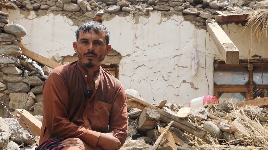 A man sits in front of his earthquake damaged home in eastern Afghanistan. Photo: WFP/Arete
