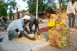 A woman buys food at a market with cash she received from WFP, thanks to EU funding. © WFP/Joseph Fambove