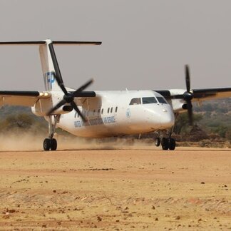 An UNHAS flight lands at Farchana.